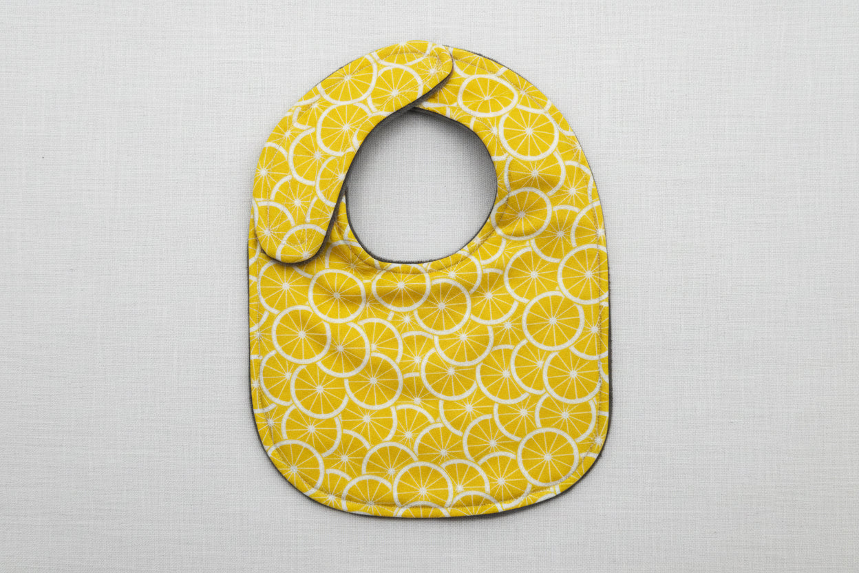 Baby bib with lemon pattern