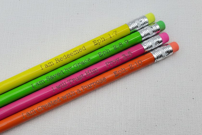 Colorful pencils with Bible scriptures etched on them