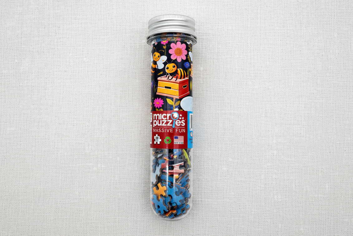 Clear tube containing colorful bee and flower puzzle