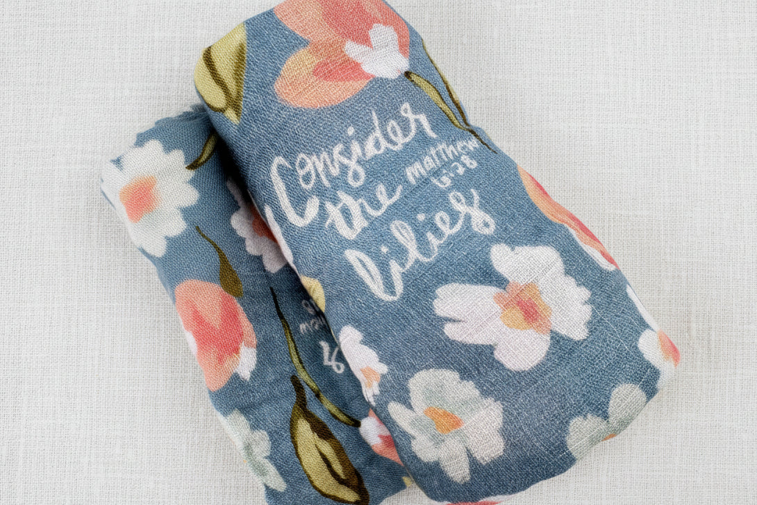 Swaddle blanket with floral-pattern with scripture verse
