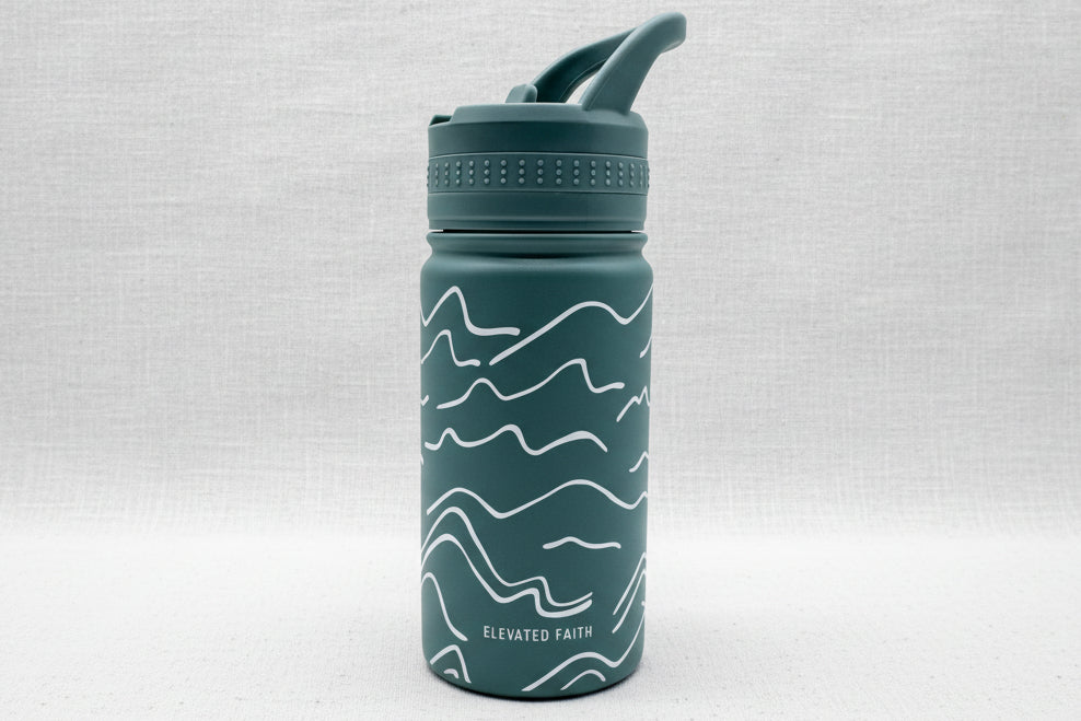 Child's green water bottle with white mountain patterns