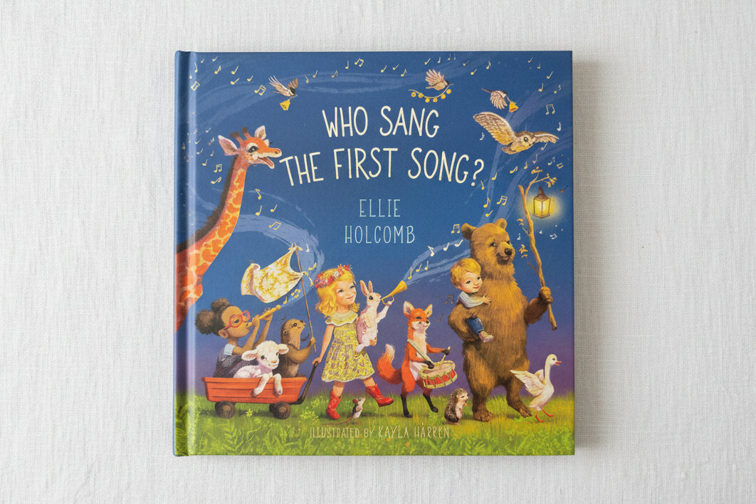 Children's book titled 'Who Sang the First Song?' by Ellie Holcomb with colorful illustrations on a blue background