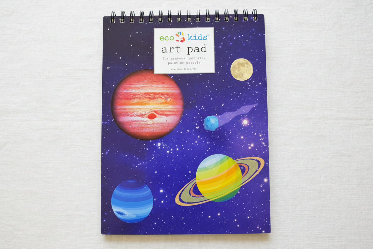 Art pad with space-themed design featuring planets and stars