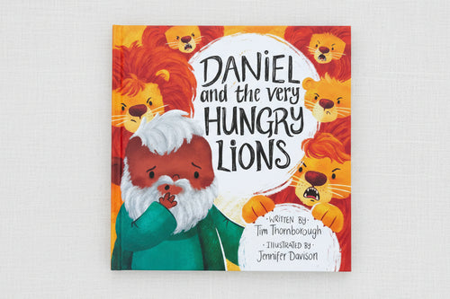 Load image 1 in gallery view. Children's book titled 'Daniel and the Very Hungry Lions' with illustration of man and lions