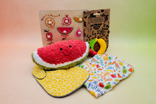 Load image 1 in gallery view. Collection of baby products including a watermelon-shaped toy, fruit shaped teether, board puzzle, onesie and bib.