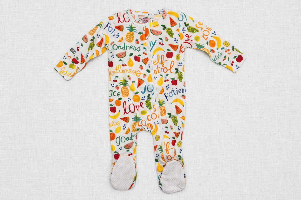 Colorful baby onesie with text and fruit patterns 