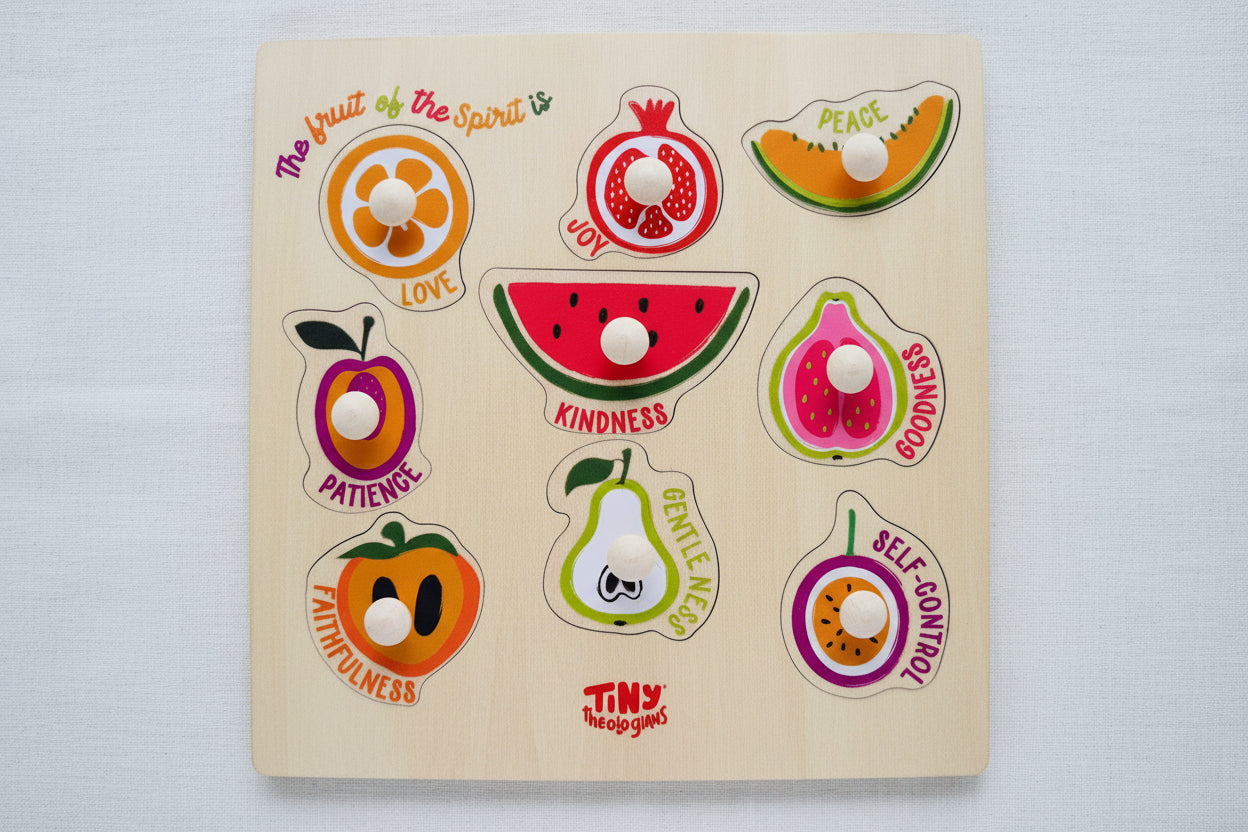 Wooden puzzle with fruit-shaped pieces and corresponding virtues 
