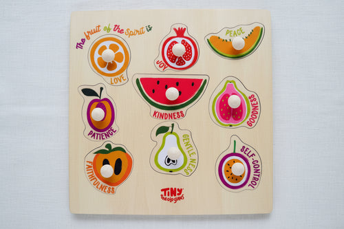 Load image 1 in gallery view. Wooden puzzle with fruit-shaped pieces and corresponding virtues 
