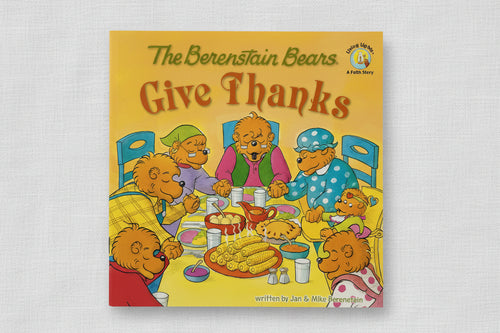 Load image 1 in gallery view. The Berenstain Bears "Give Thanks" children's book, featuring a bright yellow cover with an illustration of the bear family gathered around a table with food and thanksgiving themes.