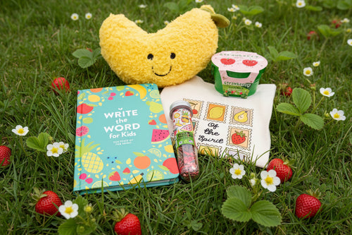 Load image 1 in gallery view. Plush banana toy, book, puzzle and strawberry growing kit with grass and strawberries in background