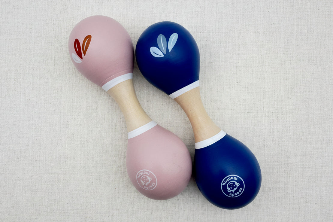 Two maracas, one pink and one blue
