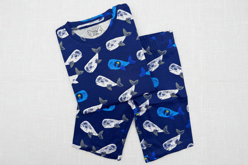 Load image 1 in gallery view. Children's navy blue pajama set with whale pattern 