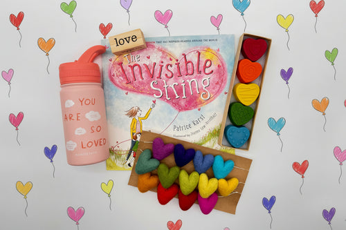 Load image 1 in gallery view. Book titled 'The Invisible String' with colorful heart-shaped string, crayons and a water bottle 
