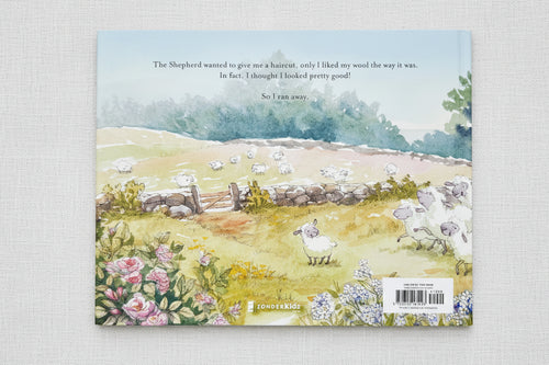 Load image 1 in gallery view. Back of book  with a scenic illustration of a path, flowers, and sheep 