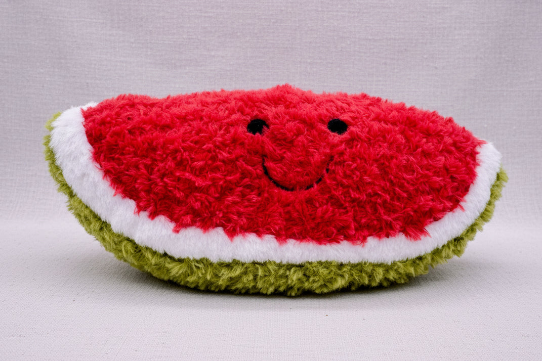 Plush toy shaped like a watermelon with smiley face